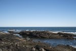The rocky coastline on which the house sits.